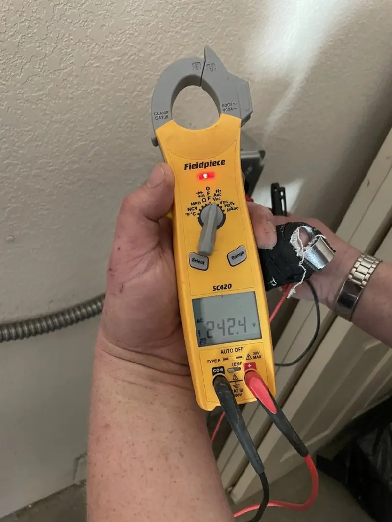 Voltage testing with clamp meter during Ceiling Fan Installation in East St. Louis